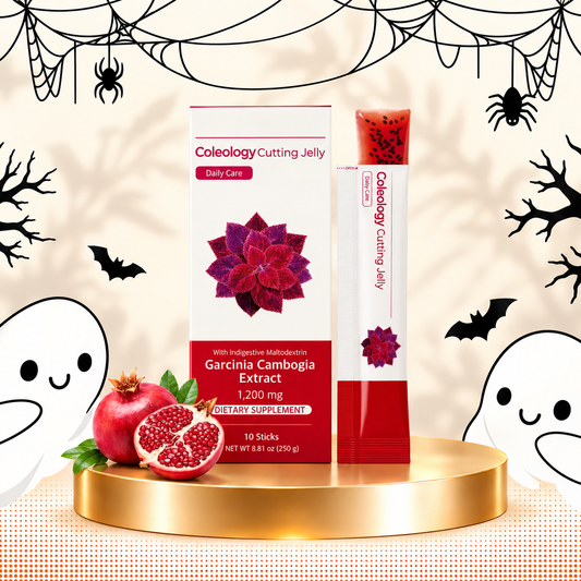 Coleology Cutting Jelly dietary supplement box and stick pack displayed on a gold pedestal with pomegranate slices, against a Halloween-themed beige background with ghosts, bats, and spiderwebs.